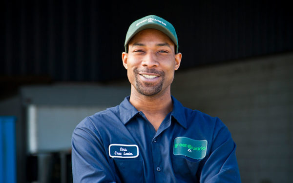 Image of smiling Goodwill Greenworks employee