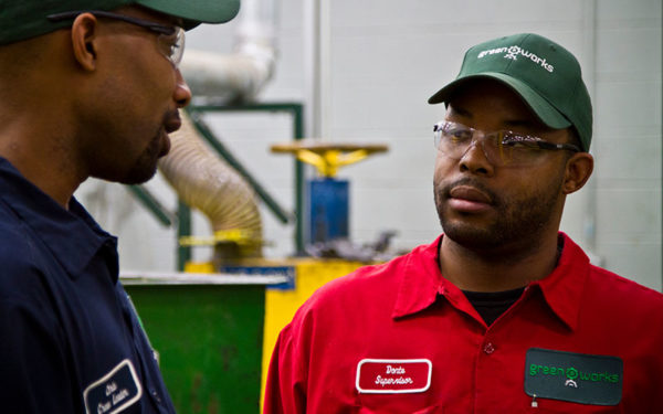 Image of two Goodwill Greenworks employees having a conversation