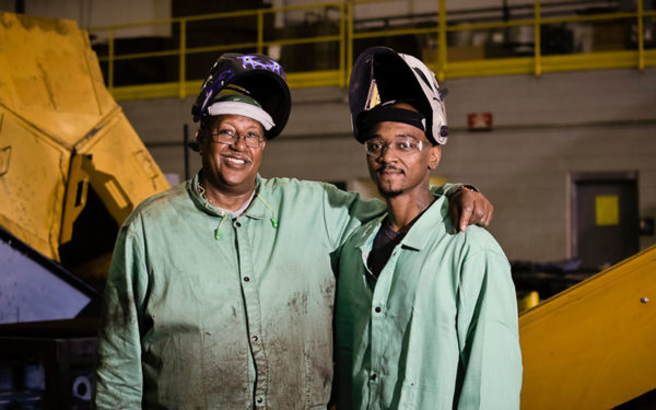 Image of two Goodwill Greenworks employees standing together