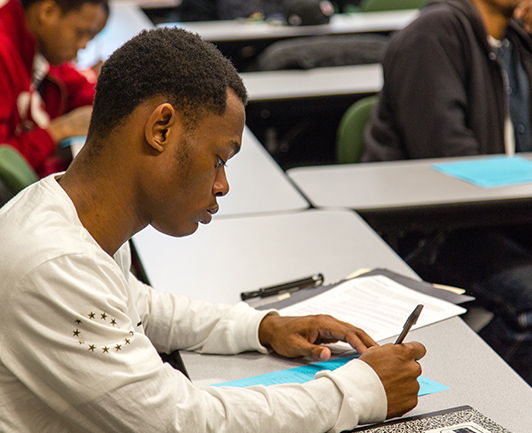 Image of man taking down notes in Flip the Script class