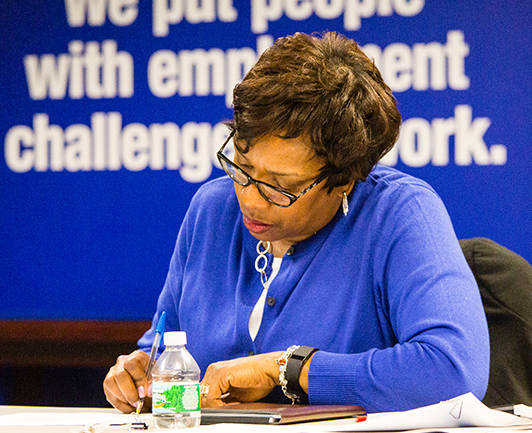 Image of woman writing something down