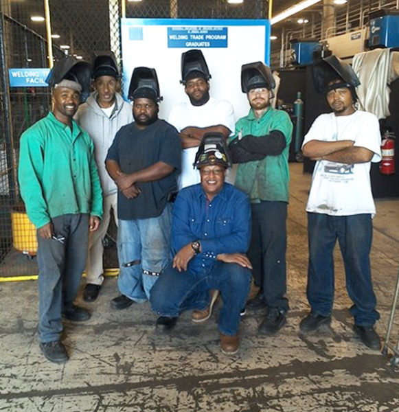 Group shot of Goodwill Greenworks employees and Julius Norman for Goodwill Reflections