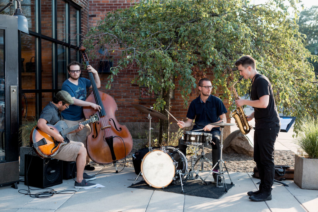 A Jazz Quartet playing outside of Shinola's flagship store at the SP reception.