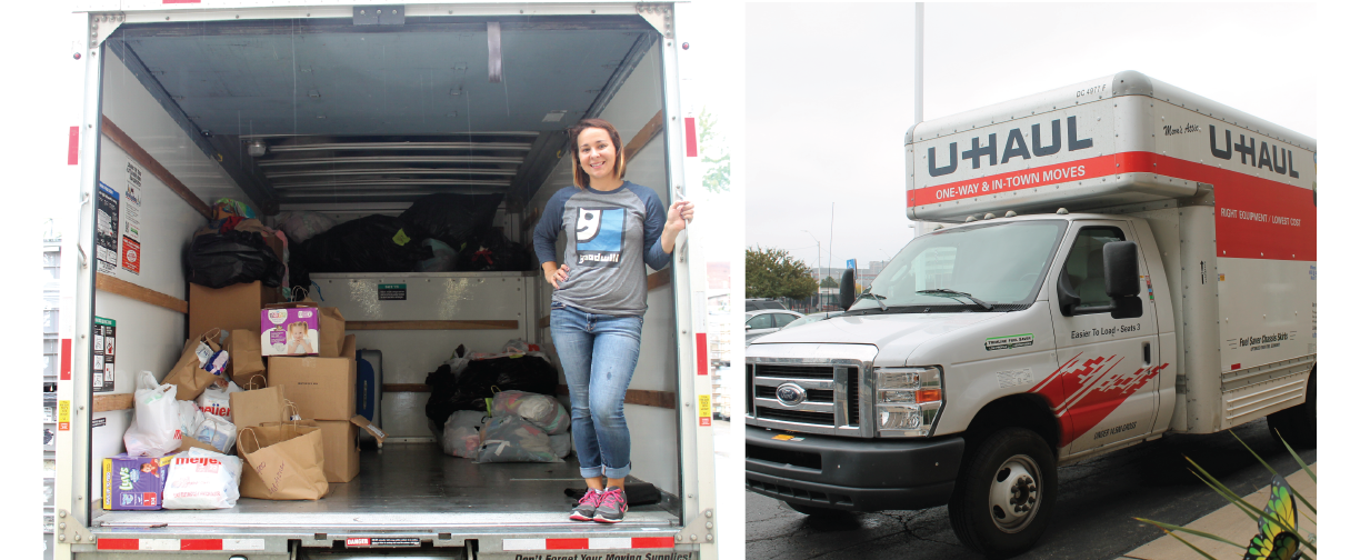 Woman stands in the trailer of a large U-Haul truck in front of boxes of donations.